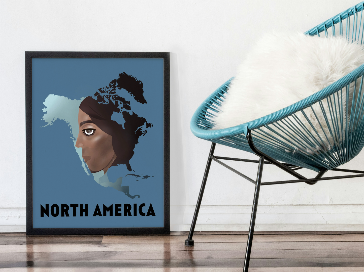 Framed artwork of a map of North America with a person's face, placed next to a modern chair.