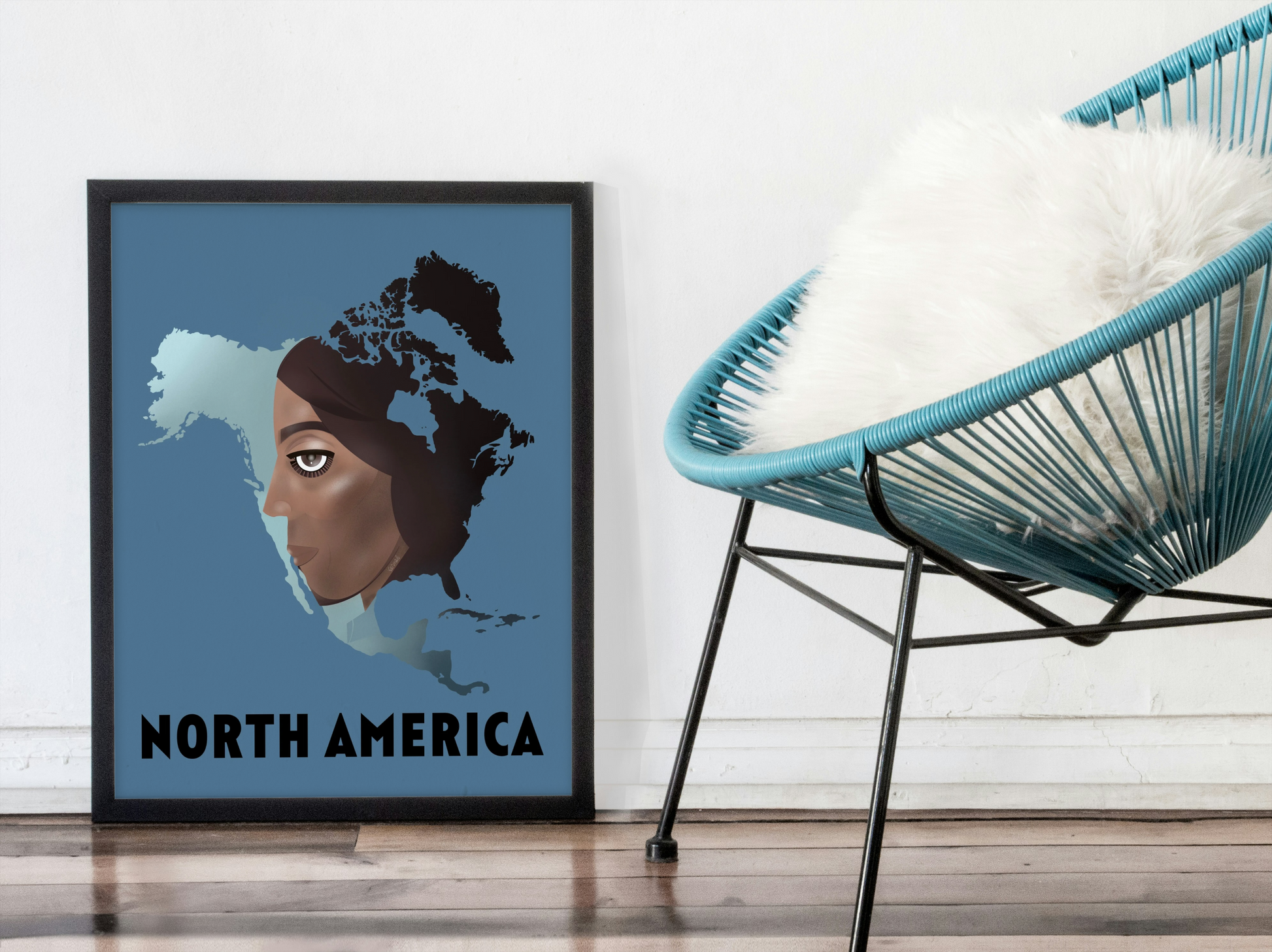 Framed artwork of a map of North America with a person's face, placed next to a modern chair.