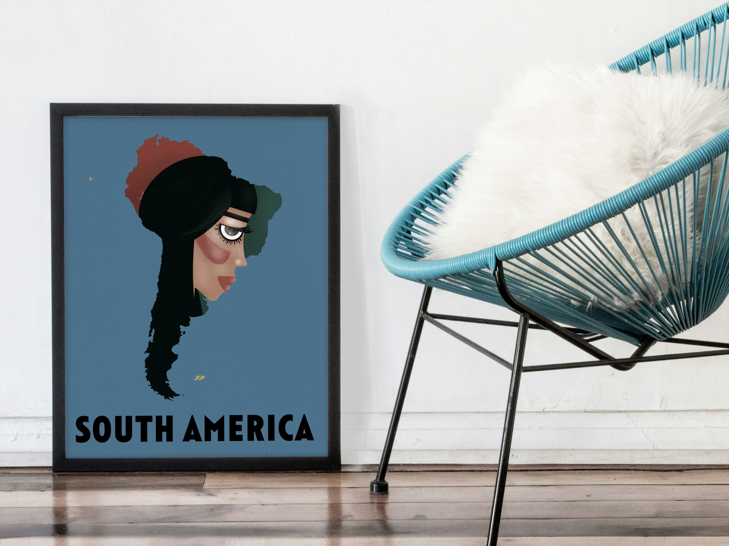 Framed artwork of a stylized map of South America on a wall next to a modern chair.